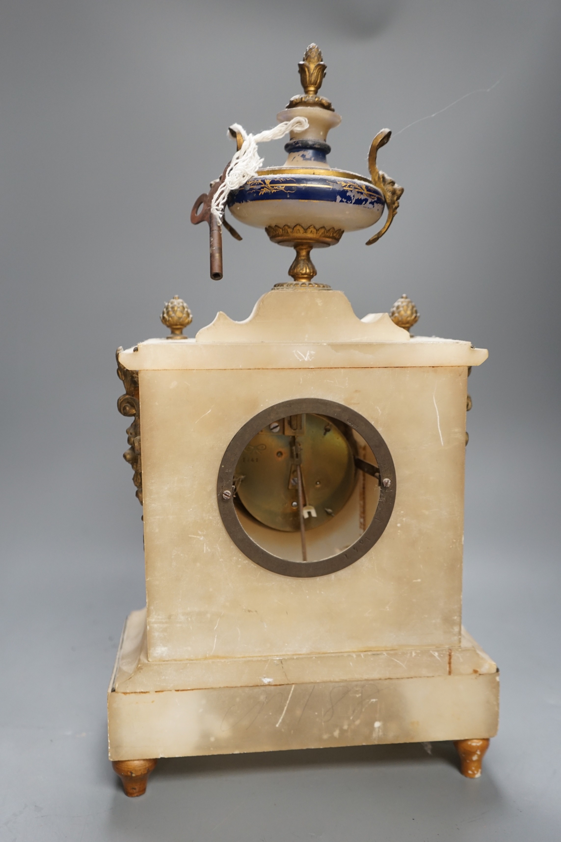 A French alabaster gilt mounted mantel clock, 44cms high